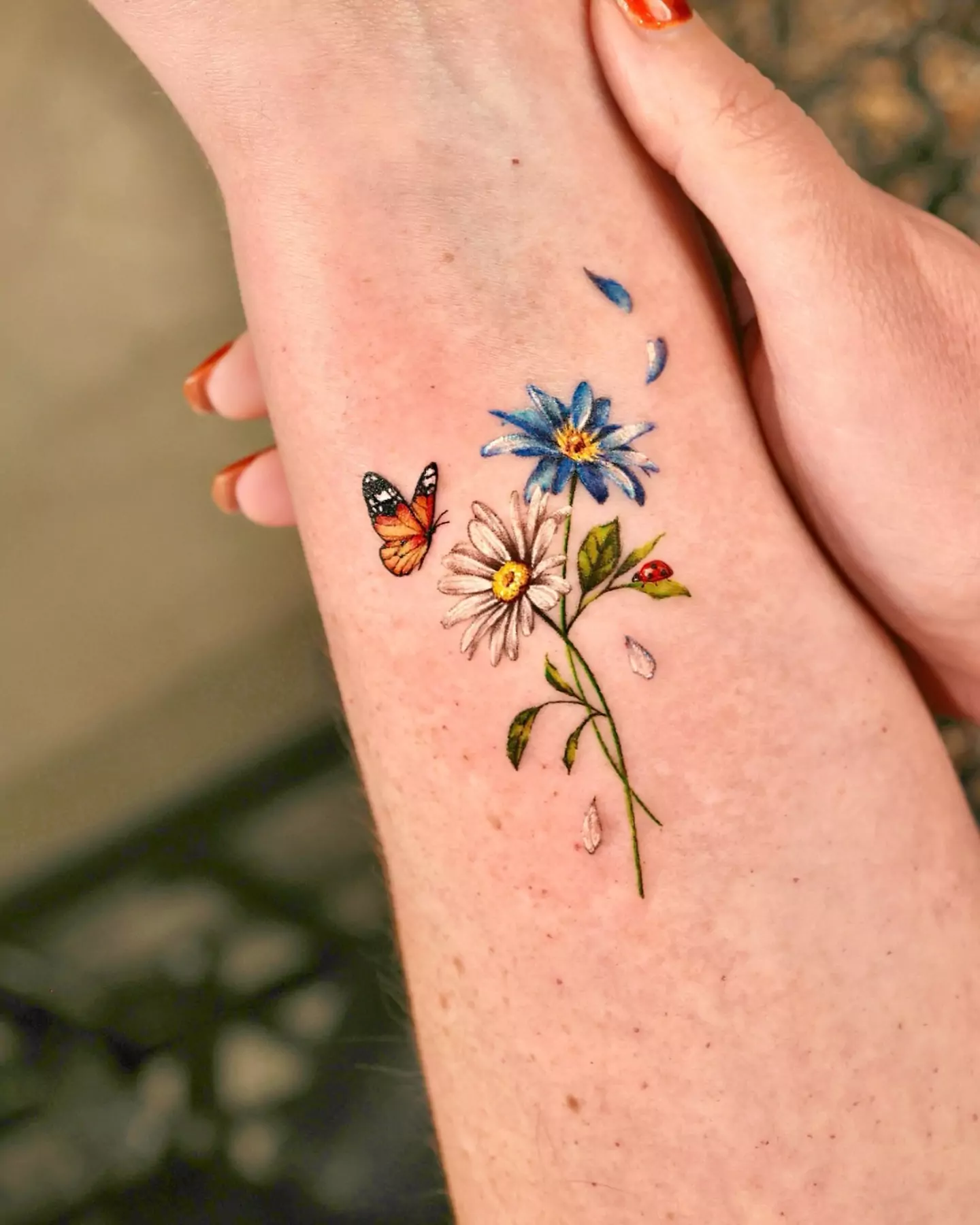 small butterfly and flowers tattoo