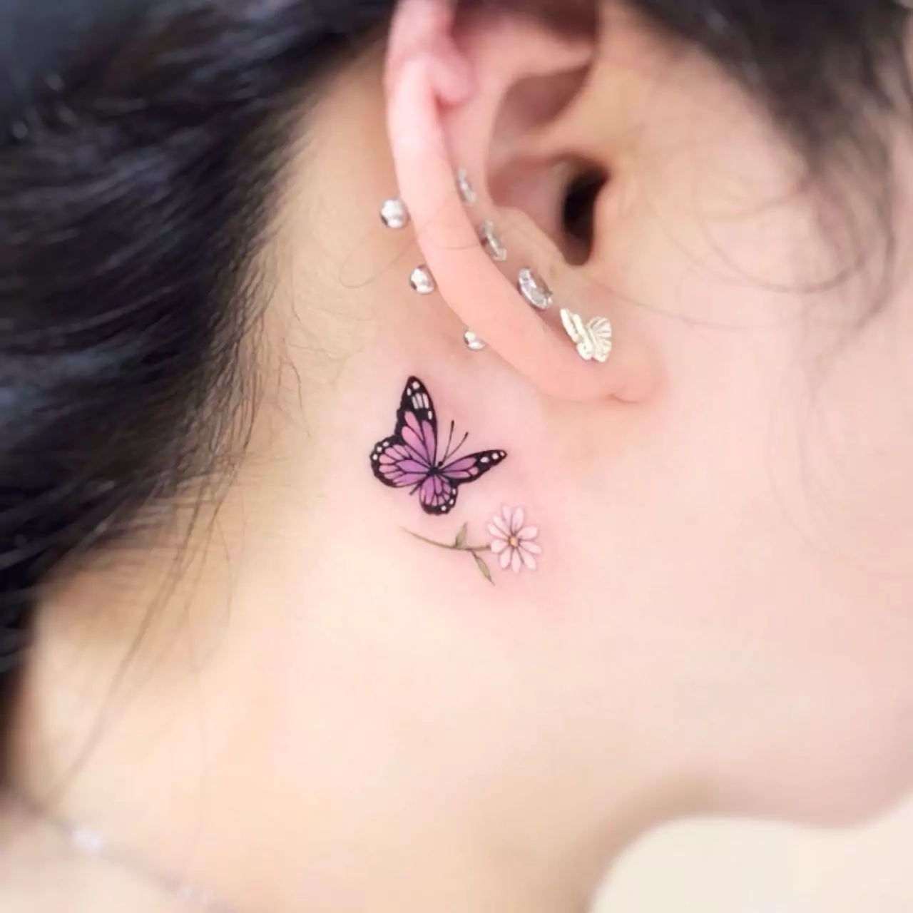 small butterfly ear tattoo