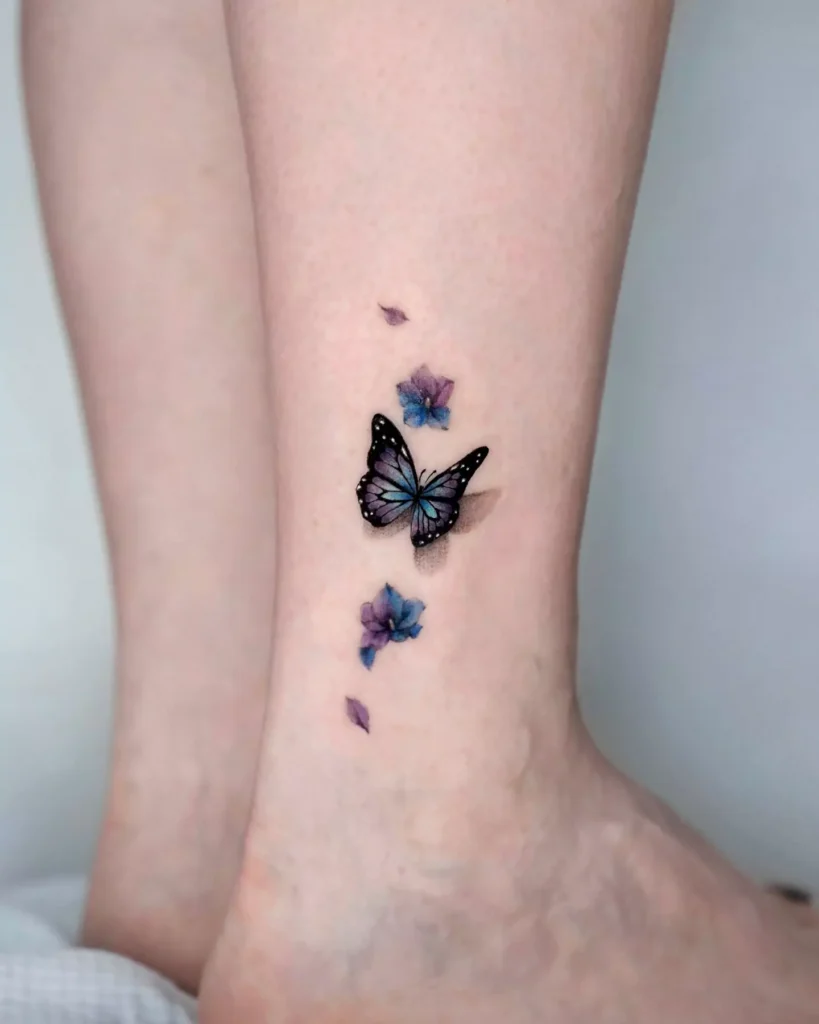 small butterfly tattoo on leg