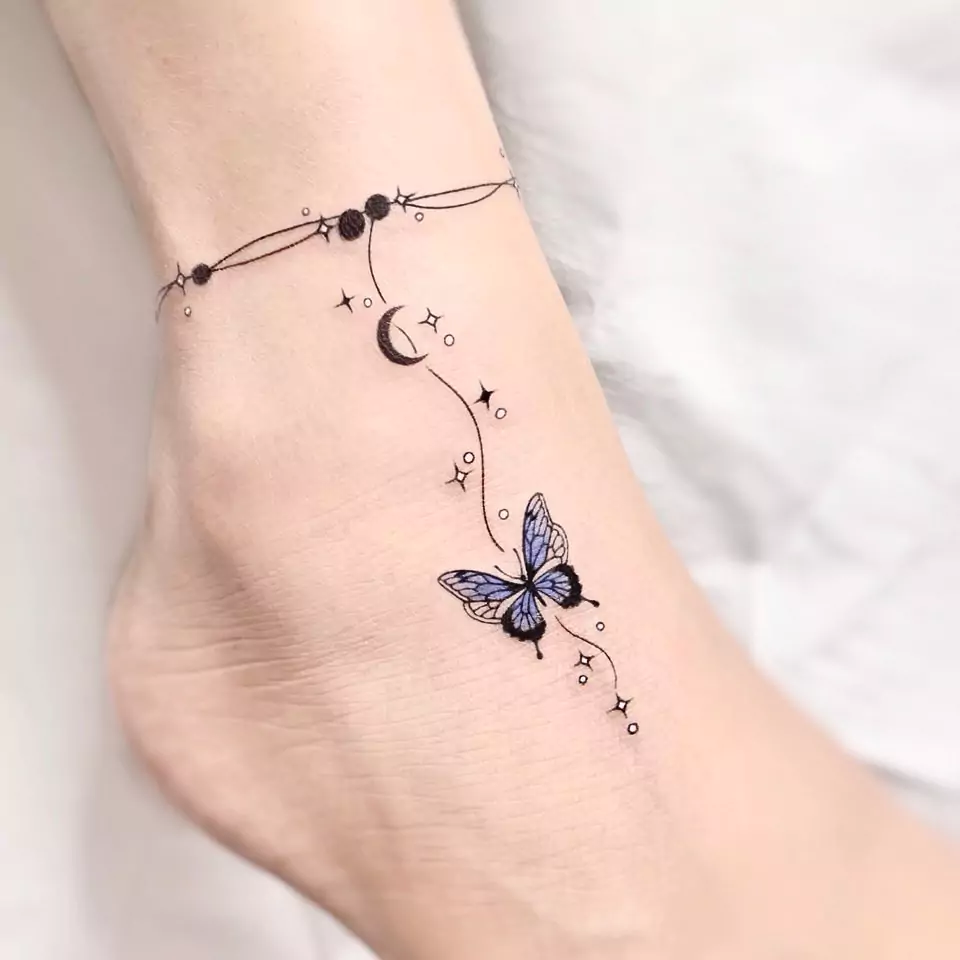 small butterfly tattoo on ankle