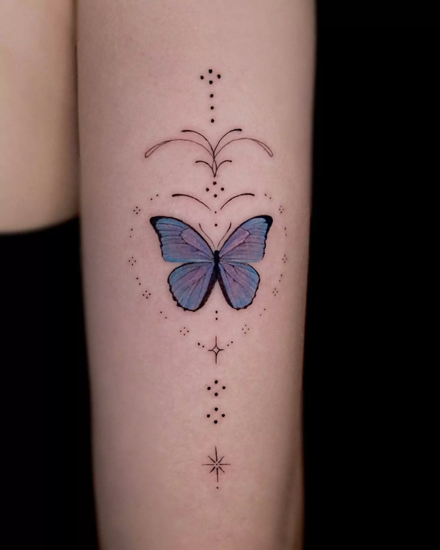 small dots and butterfly tattoo