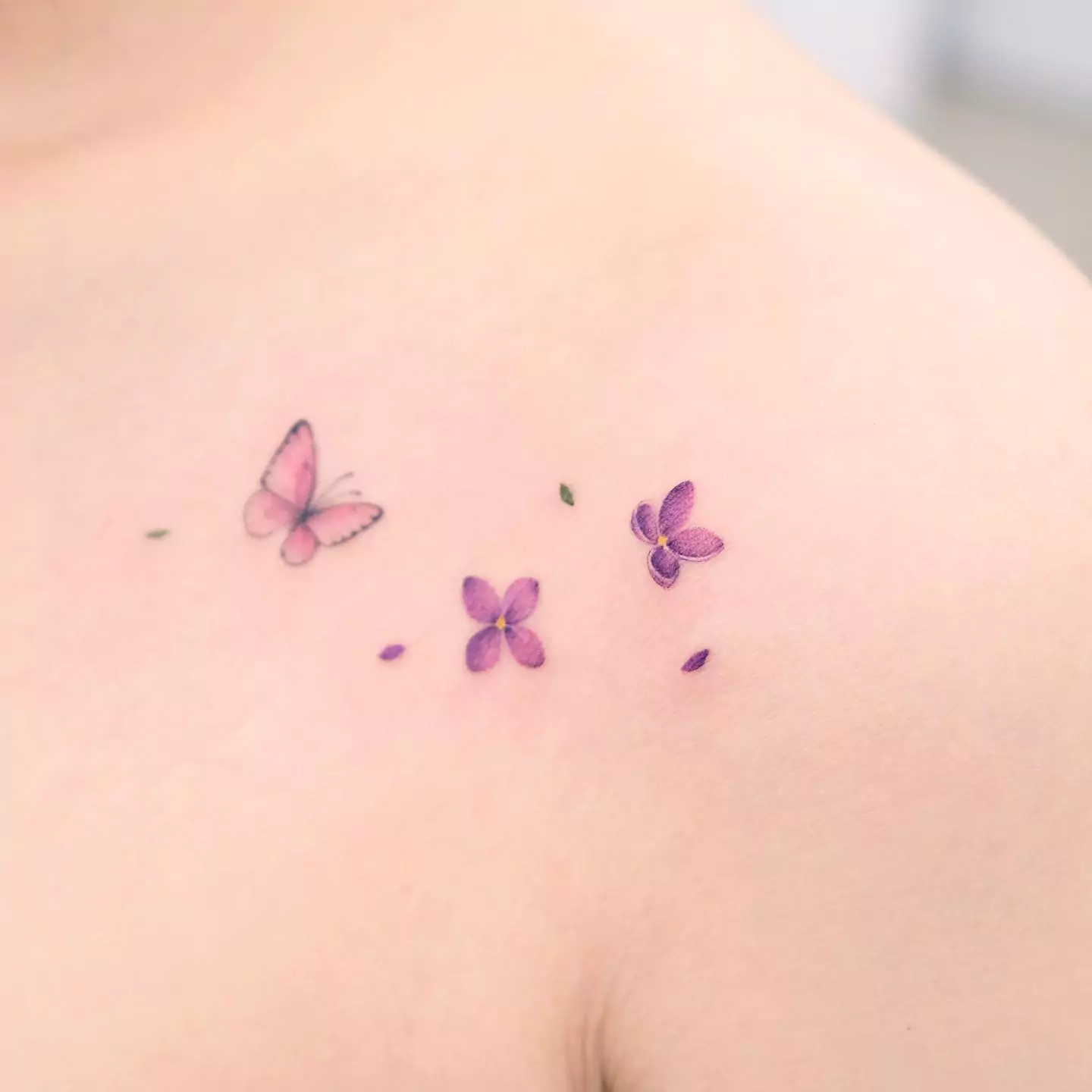 small lilac and butterfly tattoo