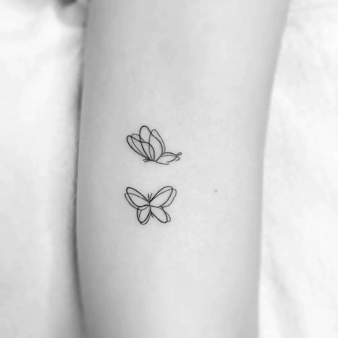 small line art butterfly tattoo