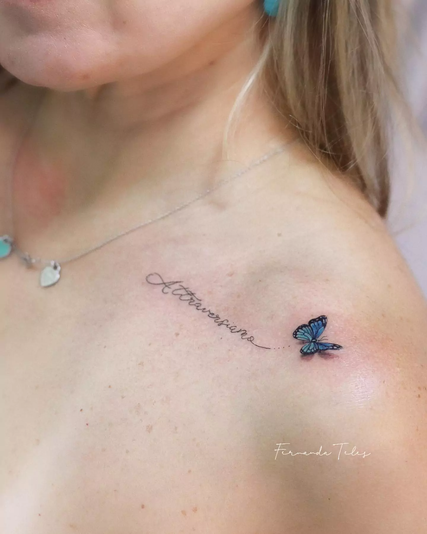 small micro realism butterfly tattoo on the shoulder