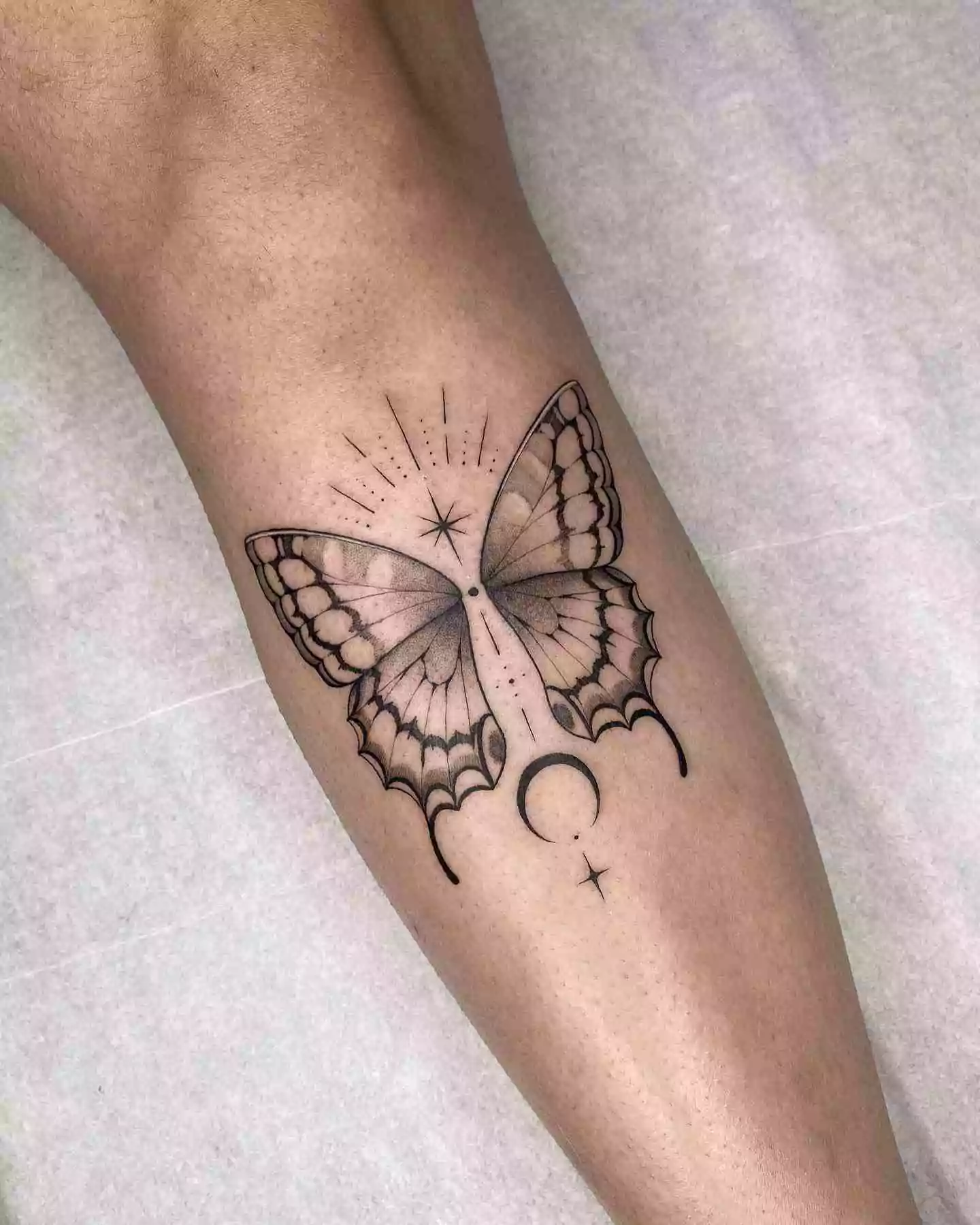 small moon and butterfly tattoo