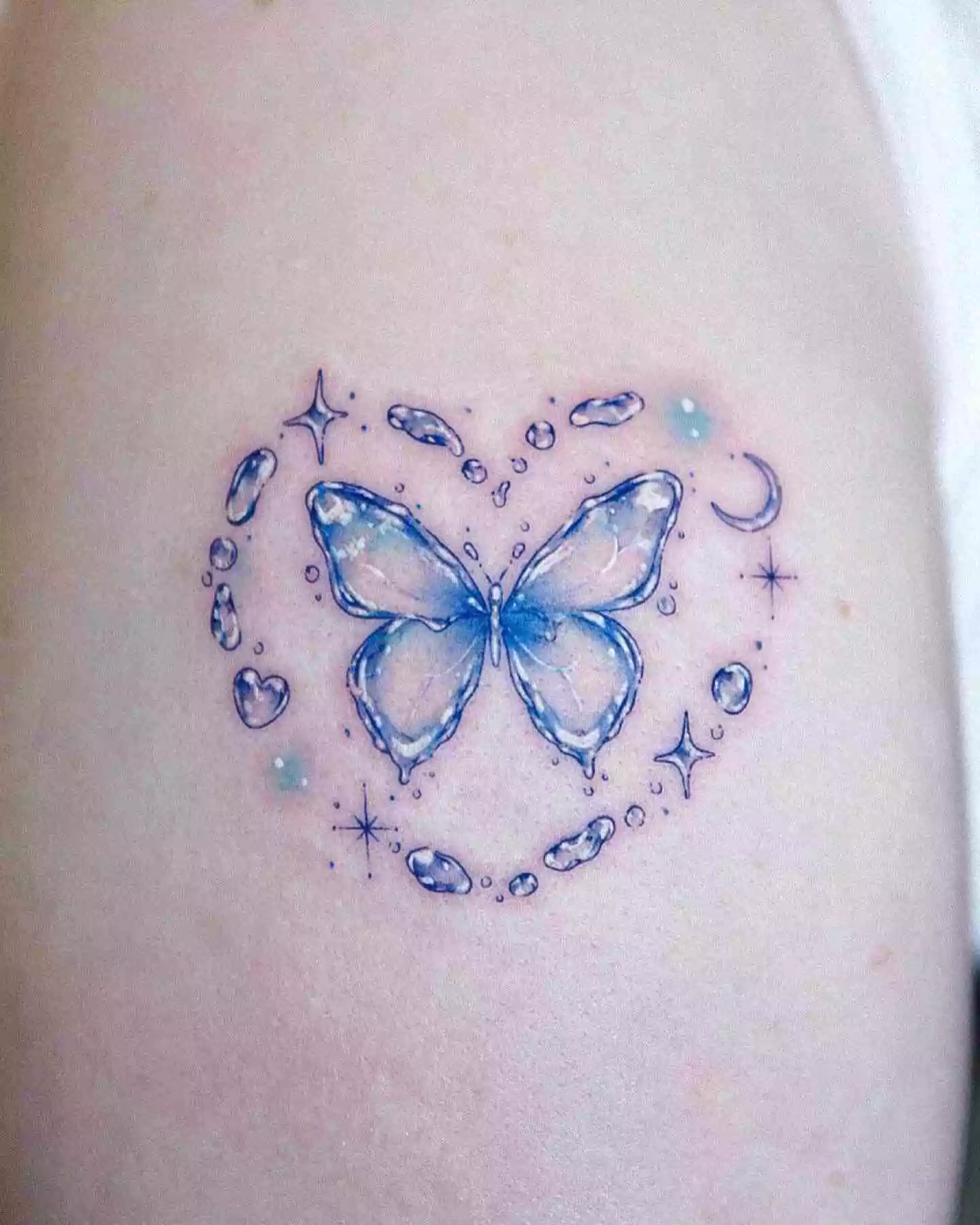 water drop style butterfly tattoo