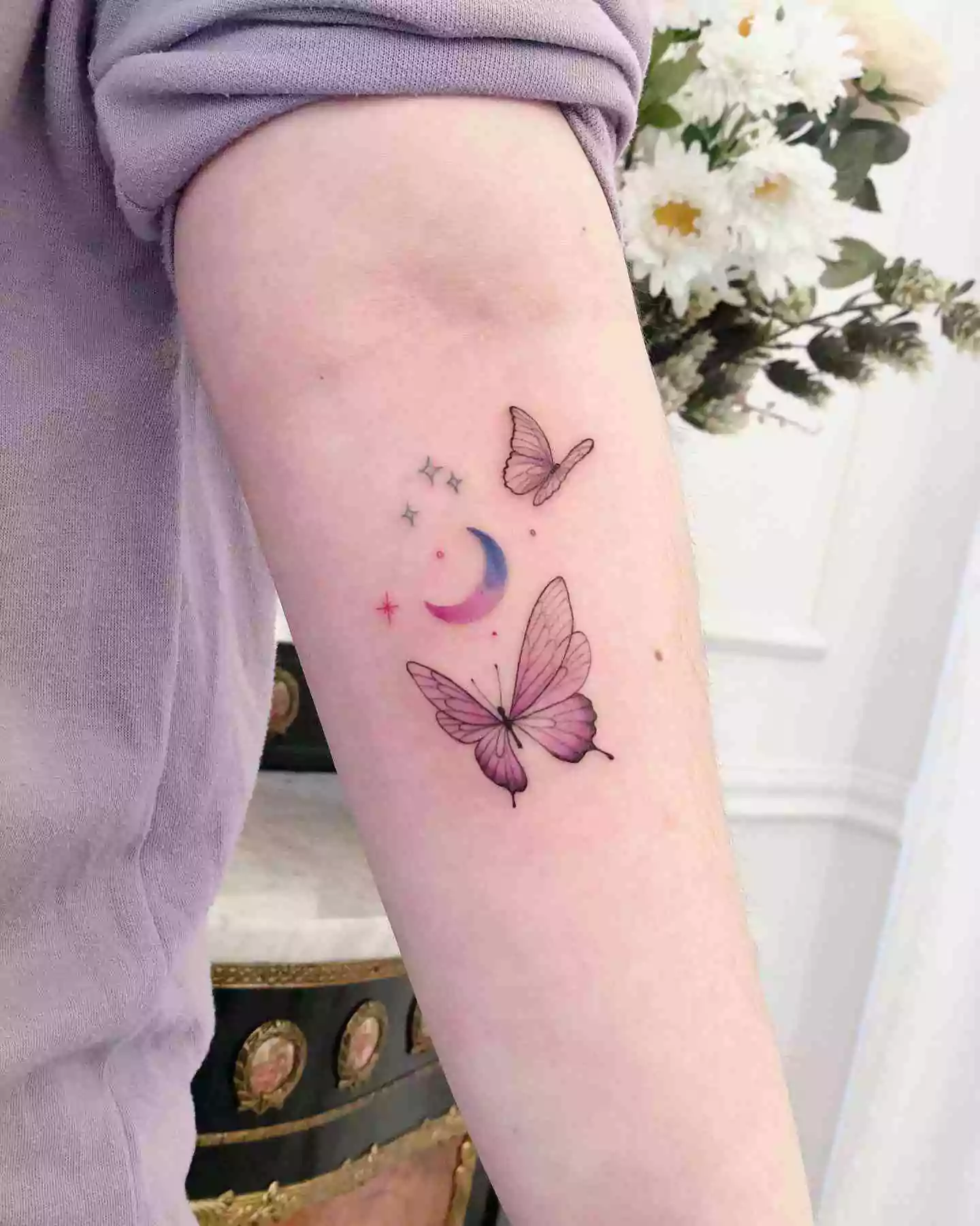 watercolor butterfly and moon tattoo