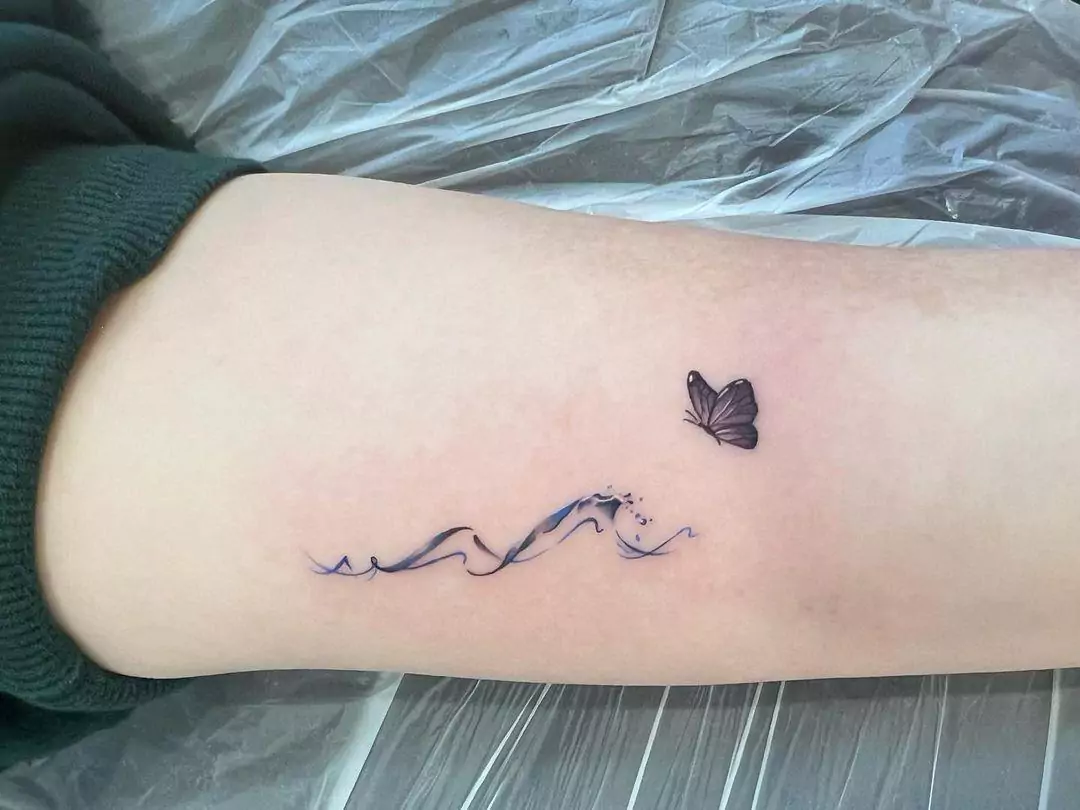 wave and butterfly tattoo