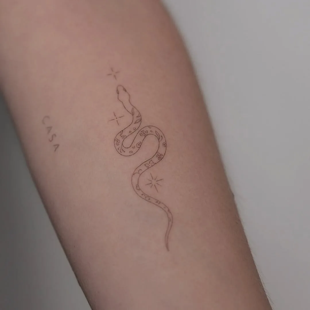 simple snake hand tattoo