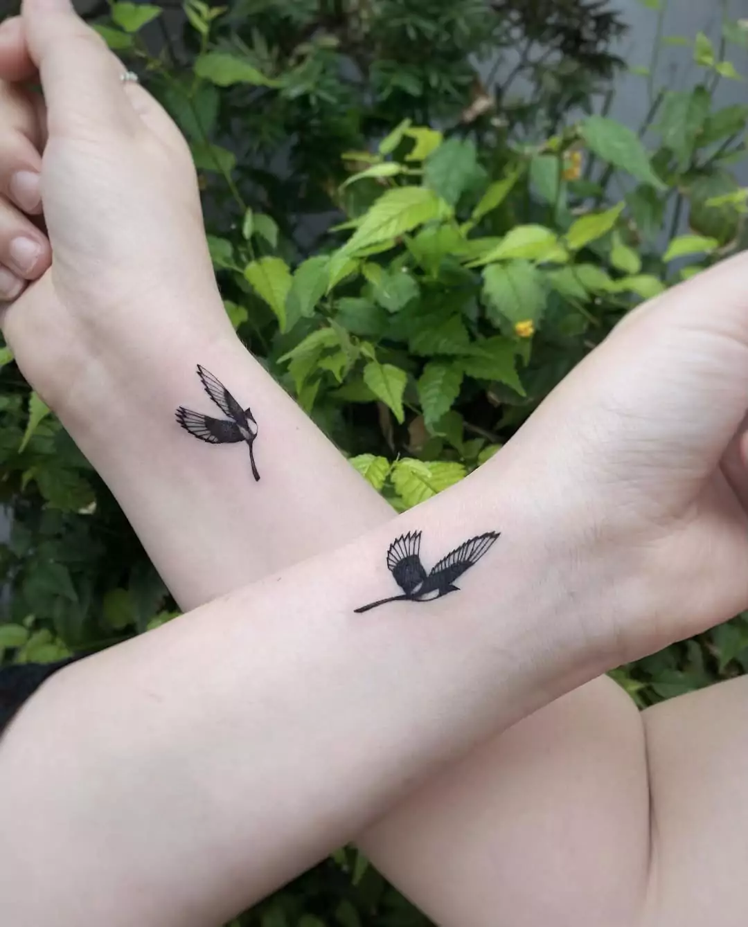 Magpie matching tattoos for friends.