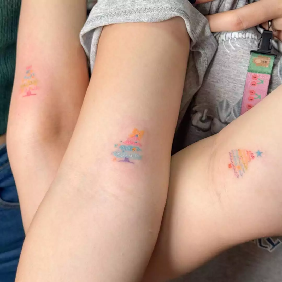 Matching Christmas tree tattoos for best friends