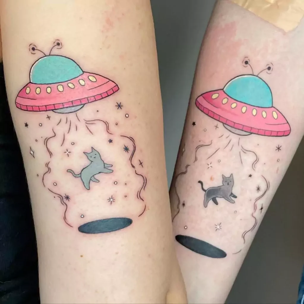 Matching colorful UFO tattoos