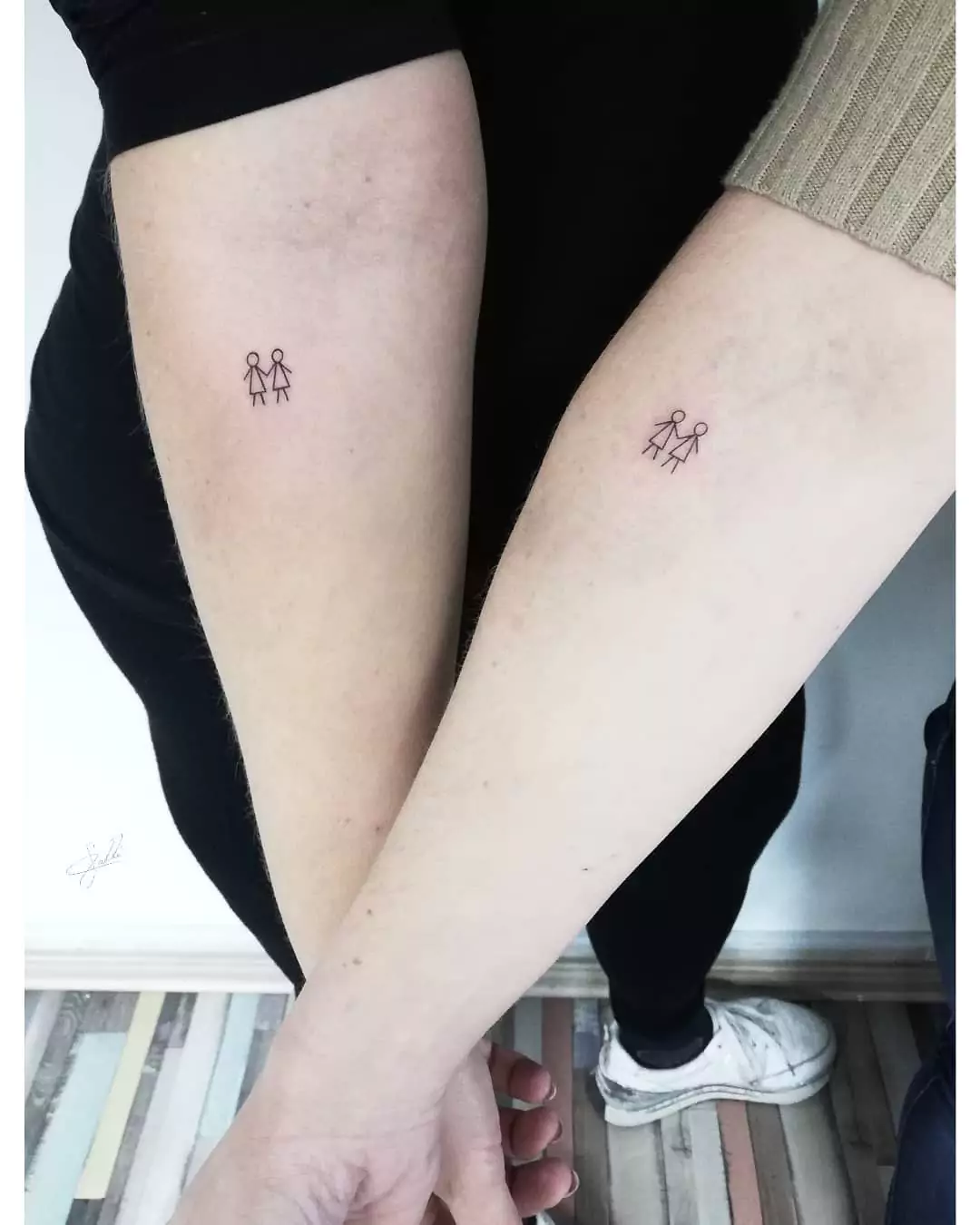 Together, matching tattoos for friends.