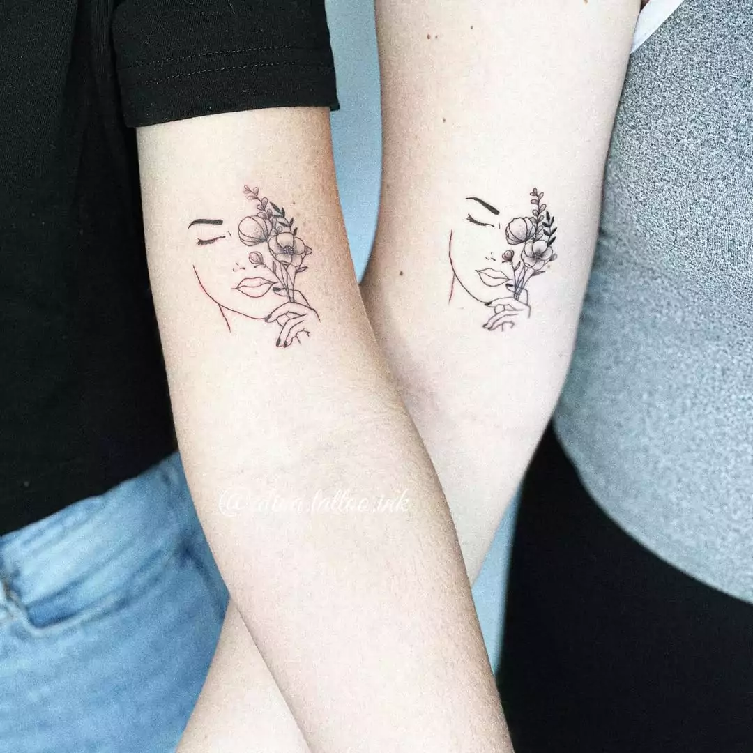 flower and women face matching tattoos for friends